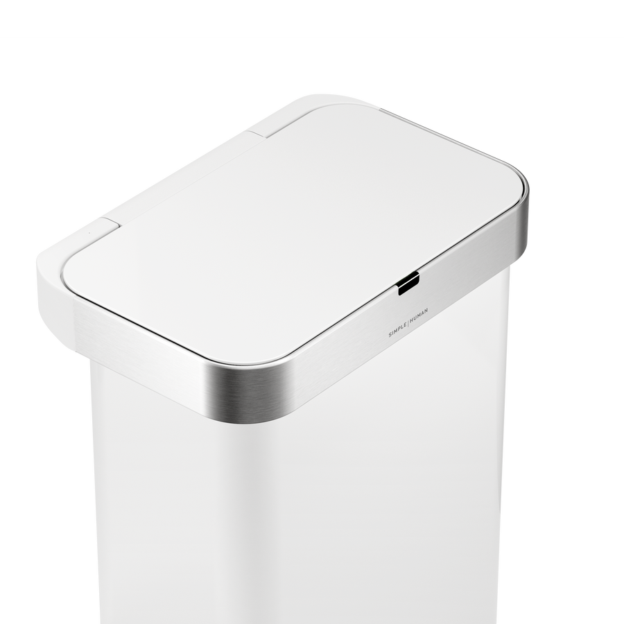 Detail view of Simplehuman 58L Sensor Can in White showing the touch-free sensor and Brushed Stainless Steel trim.