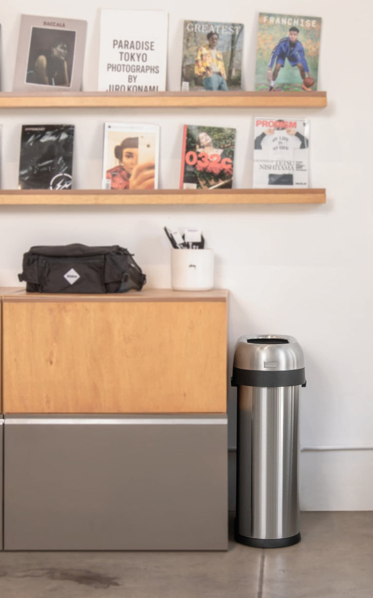 Simplehuman's Slim Open Can in a cafe setting. 
