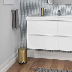 4.5L round step can - brass finish - lifestyle in bathroom next to wall