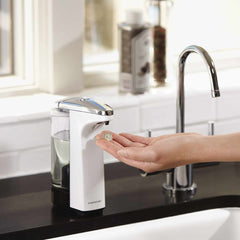 8 fl.oz. sensor pump - white finish - lifestyle hand using pump on kitchen countertop
