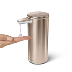 rechargeable liquid soap sensor pump - rose gold finish - hand under pump image