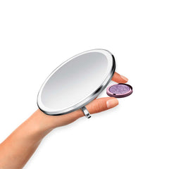 sensor mirror compact 3x - brushed finish - hand holding makeup image